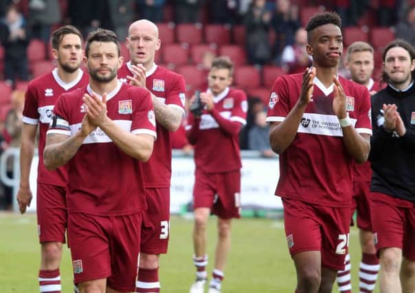 DISAPPOINTMENT - the Cobblers players applaud the Sixfields fans at the end of Saturday's defeat to Wycombe (Pictures: Sharon Lucey)