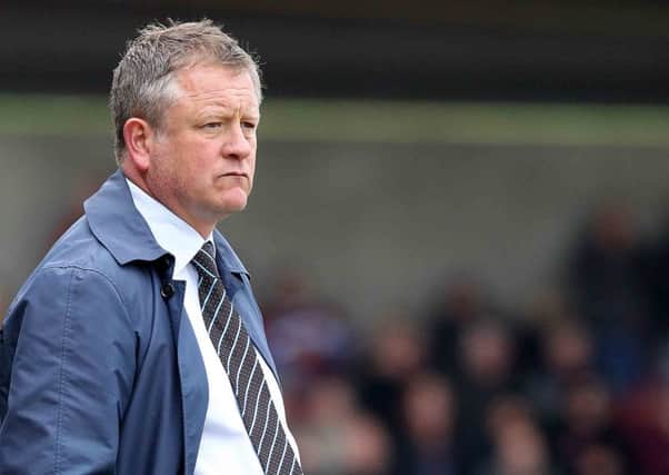 NOT IMPRESSED - Cobblers boss Chris Wilder watches his team lose 3-2 to Wycombe Wanderers (Picture: Sharon Lucey)