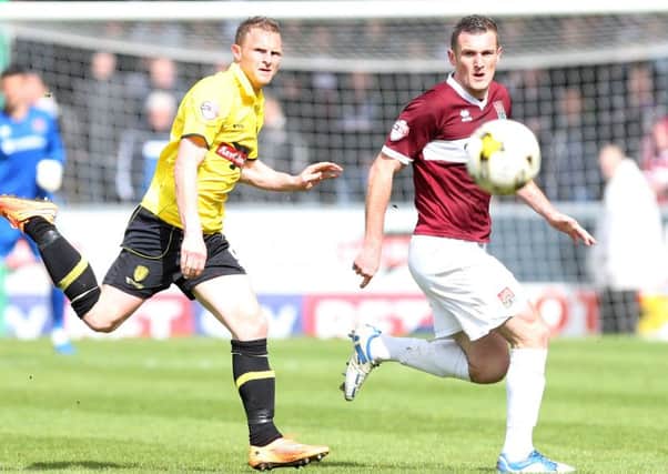 RELEASED - Lee Collins in action during what proved to be his final game for the Cobblers at Burton on April 25