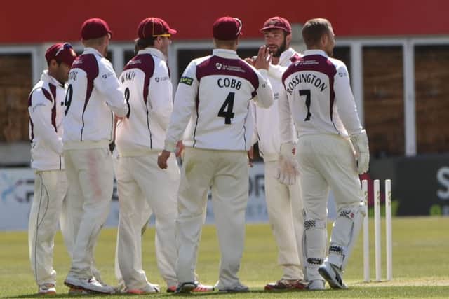 The Northants players celebrate finally dismissing Ashwell Prince in the draw against Lancashire