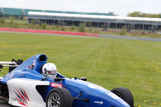 Madness driving challenge at Silverstone Circuit. Suggs is pictured in the blue car Silverstone 1. NNL-151105-101423009