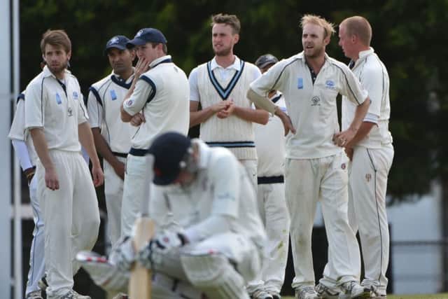 JOY AND PAIN - Rushden's players celebrate a wicket in their win over Horton House last weekend (Picture: Dave Ikin)