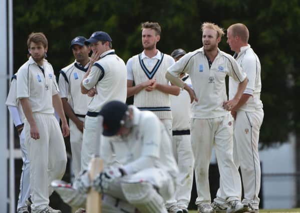 JOY AND PAIN - Rushden's players celebrate a wicket in their win over Horton House last weekend (Picture: Dave Ikin)
