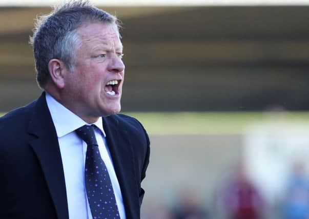KEEPING BUSY - Cobblers boss Chris Wilder is close to tying down his first signings of the summer