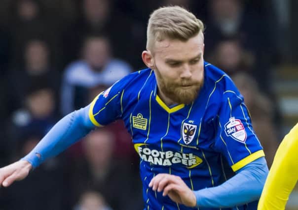 Alfie Potter in action for AFC Wimbledon in March