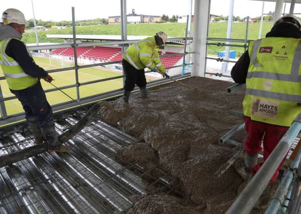 Workmen concreting the second floor of the east stand at Sixfields this week (Picture: Pete Norton)