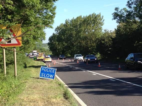 Police have cordoned off a section of the A5 near Fosters Booth after a drain collapsed in the road