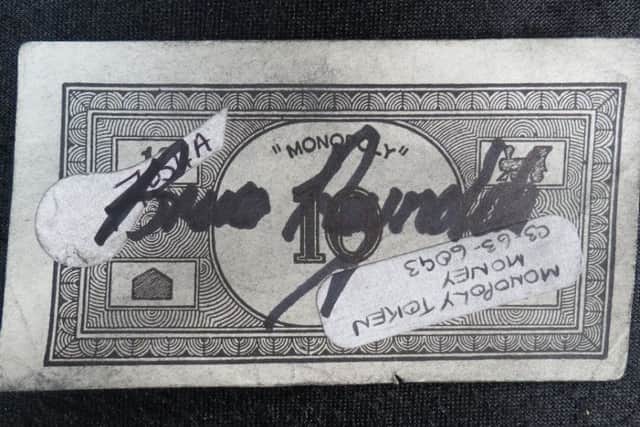 A Monopoly note used by the gang