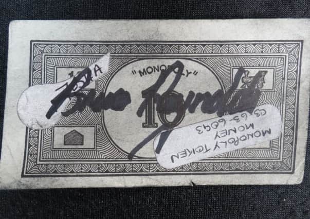 A Monopoly note used by the gang