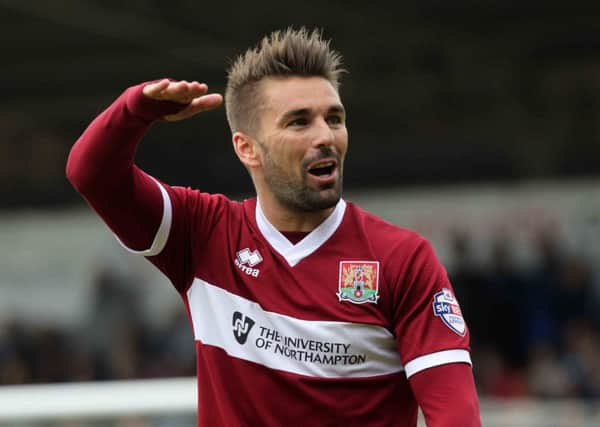 Ricky Holmes marked his return from injury by netting Northampton's third goal against Sheffield