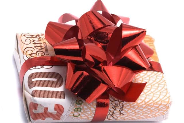 Gift money, birthday money gift-wrapped £10 note. iStock image