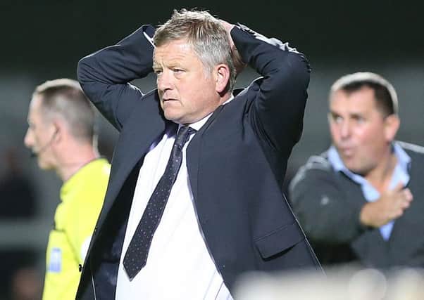 PAINFUL VIEWING - Chris Wilder watches his team lose 2-0 at Barnet (Pictures: Kirsty Edmonds)