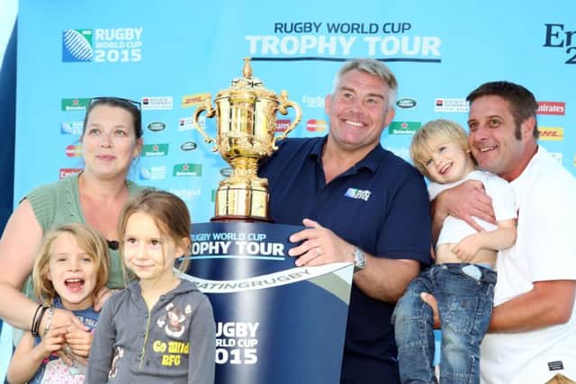 The Liverton family from Rushden  mum Sarah, with Winnie, seven, Gracie, eight, and Freddie, three, and dad Mafu, with Jason Leonard