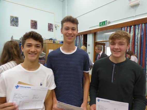 Sam Ward, Matti Ward and Cameron Mabbutt collecting their GCSE results at Guilsborough.