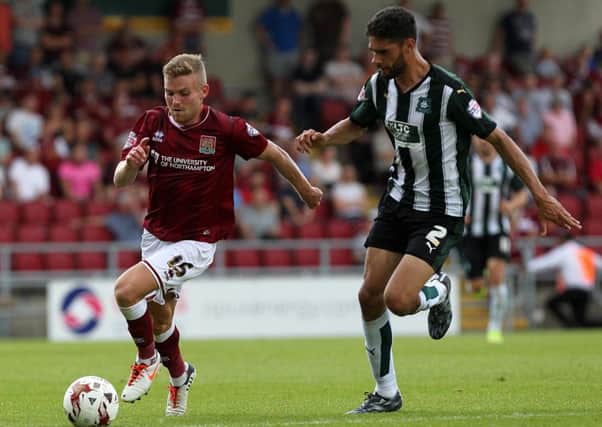 ON THE ATTACK - Alfie Potter takes on his man during the Cobblers clash with Plymouth (Pictures: Sharon Lucey)