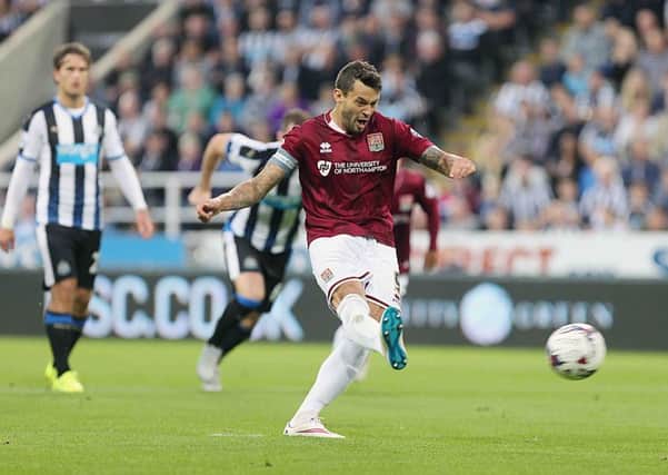 HIGH POINT - Marc Richards slams home the Cobblers penalty in their 4-1 defeat at Newcastle United (Pictures: Kirsty Edmonds)