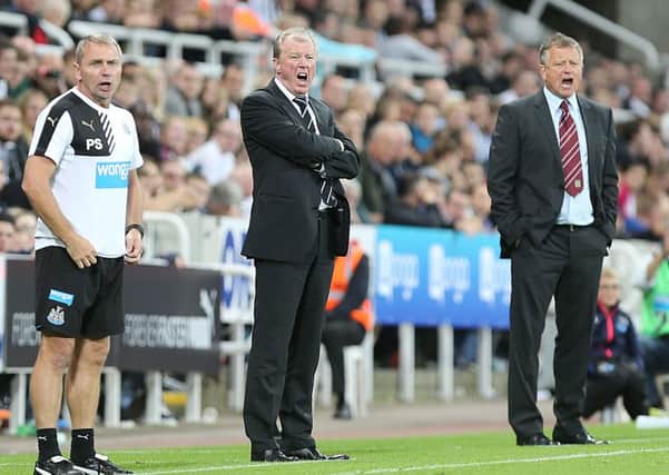 IN WITH A SHOUT - Cobblers boss Chris Wilder (right) and Newcastle boss Steve McClaren dish out the orders from their technical areas (Picture: Kirsty Edmonds)
