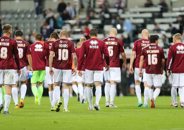 BEATEN,  BUT NOT DISGRACED - the Cobblers players trudge off the pitch following their defeat to Newcastle United (Pictures: Kirsty Edmonds)
