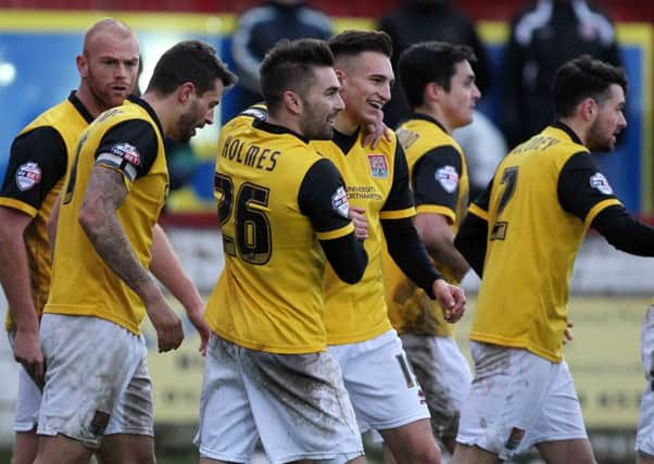 GOOD TIMES - the Cobblers celebrate one of their goals in last season's 5-1 win at Accrington
