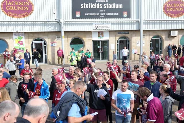 Cobblers V Oxford United. 
The 'We Want Answers' protesters outside Sixfields. NNL-150914-023717009