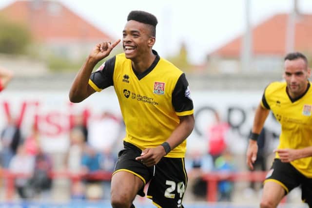 Ivan Toney celebrates the only goal of the game at Morecambe last season