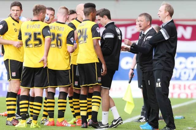 Chris Wilder and Alan Knill issue the instructions during the Cobblers' 1-0 win at Morecambe last season