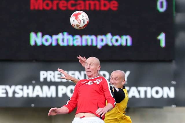 Ryan Cresswell challenges 'pantomime villain' Kevin Ellison during the Cobblers' 1-0 win at Morecambe last season