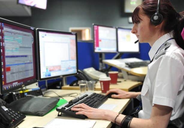 A control room operator answers calls at Northamptonshire Police headquarters. The force could soon introduce a voice recognition tool to its 101 service.