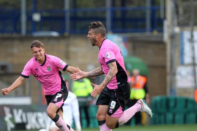 Marc Richards celebrates after pulling Northampton level with a superb free-kick against Wycombe