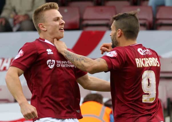 Sam Hoskins celebrates with Marc Richards after the Cobblers' opening goal in their 2-1 win over Hartlepool last Saturday
