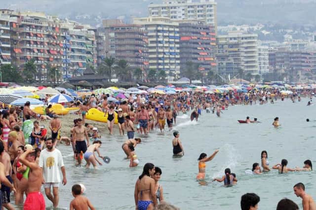 The scene on the beach at Fuengirola on the Costa Del Sol in Spain, as new research suggests that the proportion of people not going on at least one holiday a year is rising. Photo: Stefan Rousseau/PA Wire