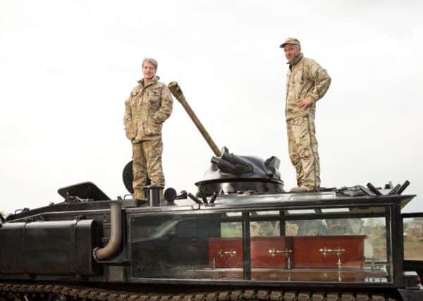 Nick Mead and Todd Chamberlain with their converted  FV432 Armoured Personnel Carrier converted into a fully functioning funeral hearse.