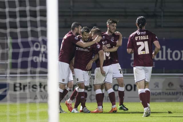CELEBRATION TIME: Cobblers celebrate during Tuesday night's win. Pictures by Kirsty Edmonds