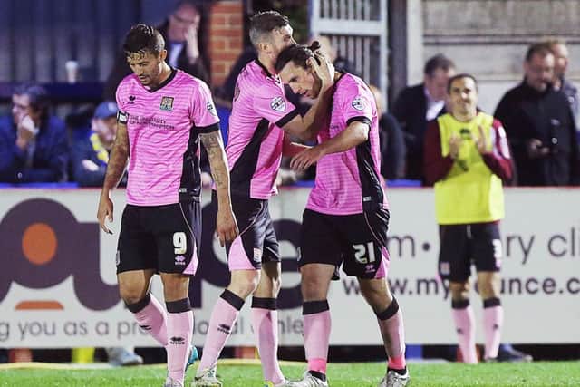 BACK IN FAVOUR - John-Joe O'Toole is congratulated after his goal in the 1-1 draw at AFC Wimbledon