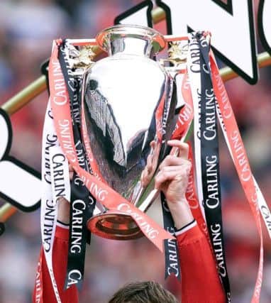 Teddy Sheringham lifts the FA Carling Premiership trophy in 2001