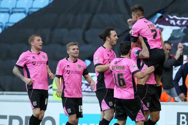 Cobblers celebrate going ahead at the Ricoh Arena. Pictures by Sharon Lucey