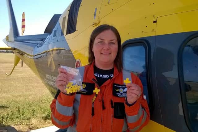 Jenny Conway selling Air ambulance Week badges