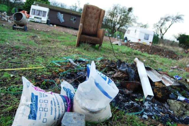 An injunction has been served on people illegally occupying a field near Nether Heyford by enforcement officers at South Northamptonshire Council