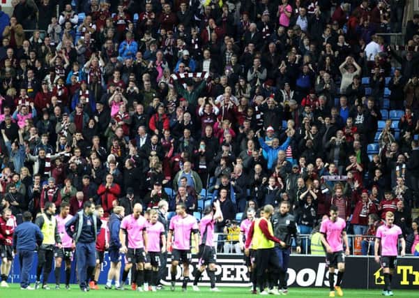 The Cobblers supporters and players enjoy the FA Cup first-round win over Coventry City