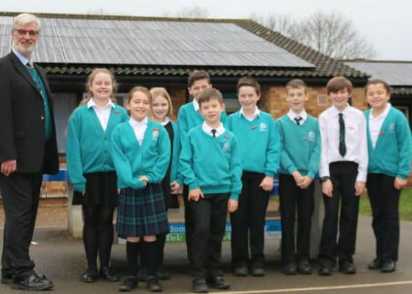 Martin Blake, school business manager, and students from Nicholas Hawksmoor School council