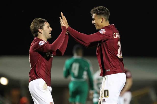 Dominic Calvert-Lewin and Ricky Holmes celebrate the winner. Pictures by Sharon Lucey