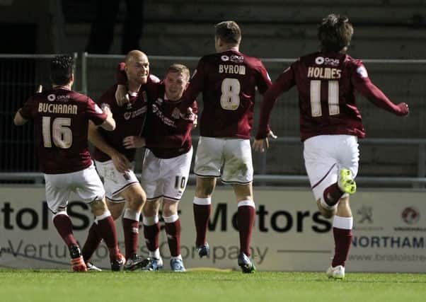 BULLET DODGED - the Cobblers players celebrate Jason Taylor's equalising goal in their 3-2 FA Cup late escape against Northwich