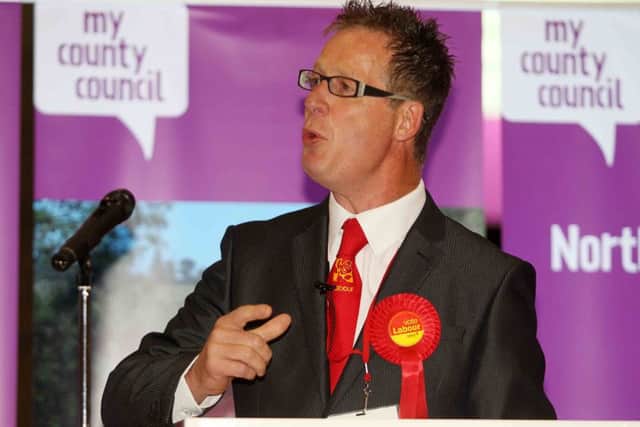 Councillor John McGhee has slammed proposed £77 million budget cuts to the county council as "unrealistic."