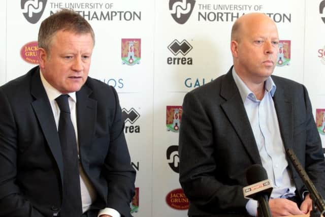 Chris Wilder, alongside then chairman David Cardoza, talks to the media on his first day as Cobblers manager