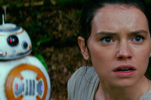 Star Wars: The Force Awakens L to R: BB-8 and Rey (Daisy Ridley)