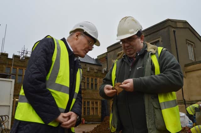 Northampton Borough Councillor Tim Hadland with Iain Soden, of Iain Soden Heritage Services, the on-site archaeologist at Delapre Abbey