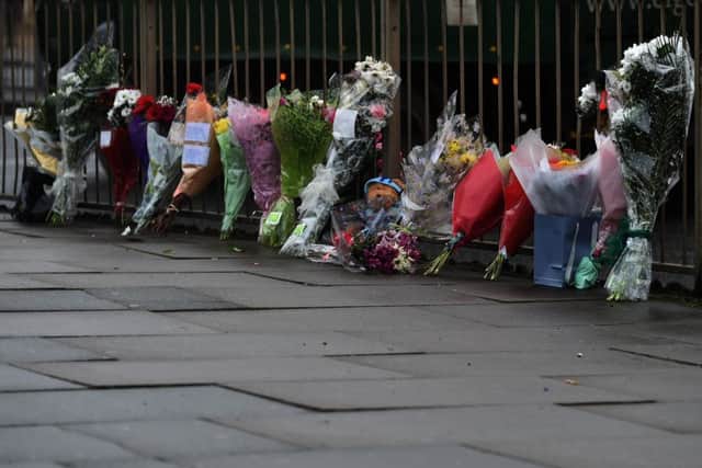 Picture of flowers at scene of murder in Barrack Road, near Lazeez restaurant
