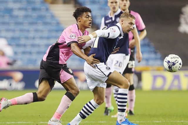 NEW SIGNING - Lee Martin tussles with Darnell Furlong in the Cobblers' Johnstone's Paint Trophy defeat at Millwall in October