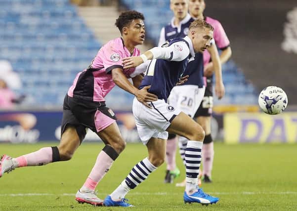 NEW SIGNING - Lee Martin tussles with Darnell Furlong in the Cobblers' Johnstone's Paint Trophy defeat at Millwall in October