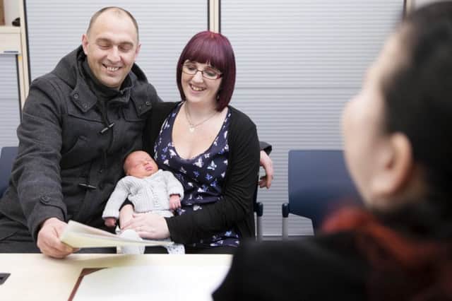 Paul Blair and partner Emma Coles register the birth of Baby Noah at the new registry offices on Abington Street.